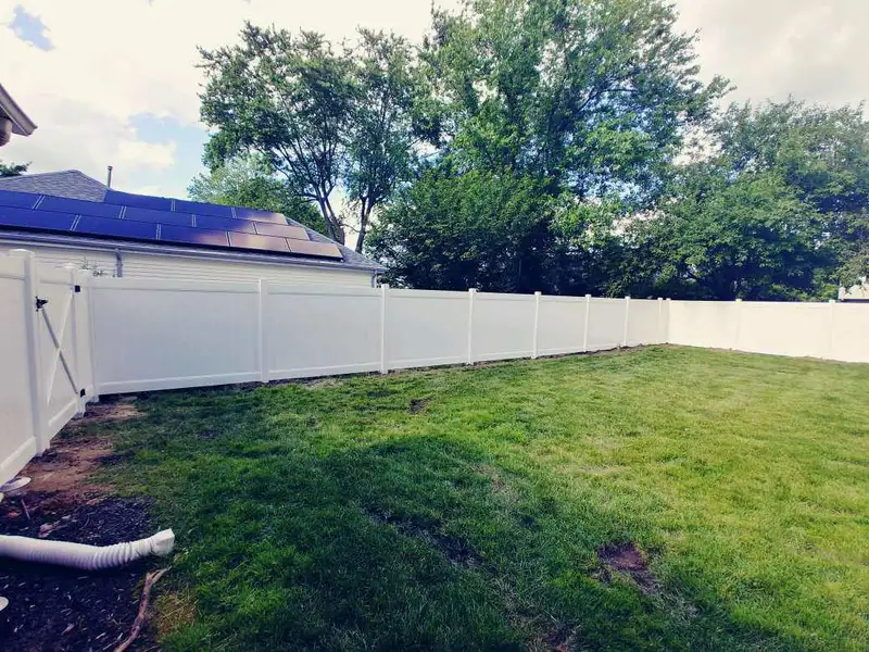 Vinyl fencing along property line by Fencing By Excellence near Atlantic Highlands, Monmouth County NJ