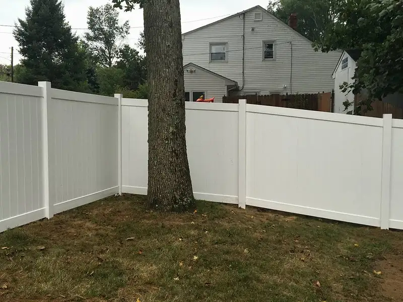 White vinyl privacy fence around yard by Fencing By Excellence near Howell, Monmouth County NJ