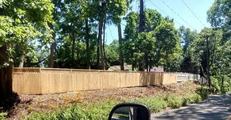 Wood fence in wooded residential setting by Fencing By Excellence near Holmdel, Monmouth County NJ