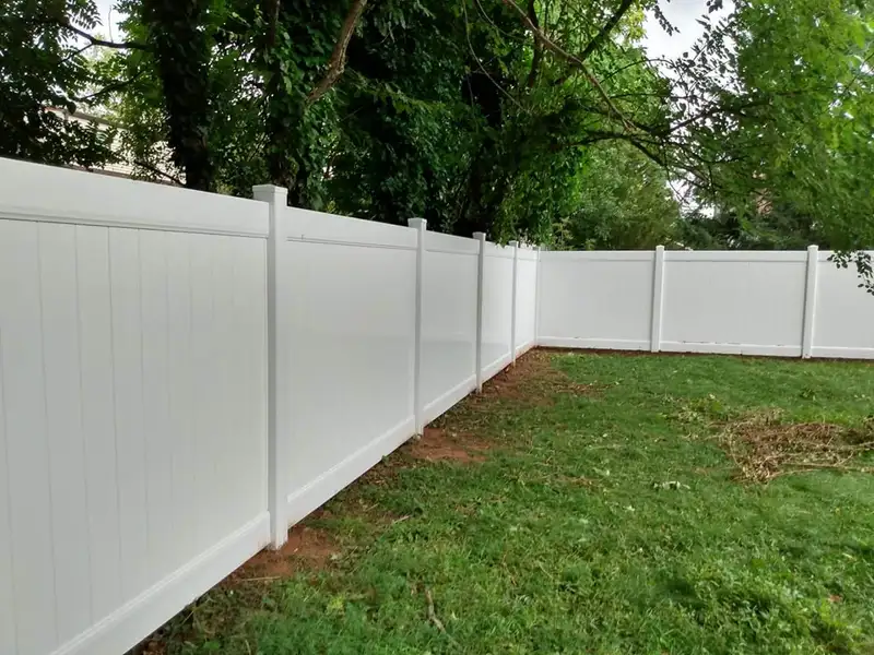 Chain link fence with gate in residential yard by Fencing By Excellence near Atlantic Highlands, Monmouth County NJ