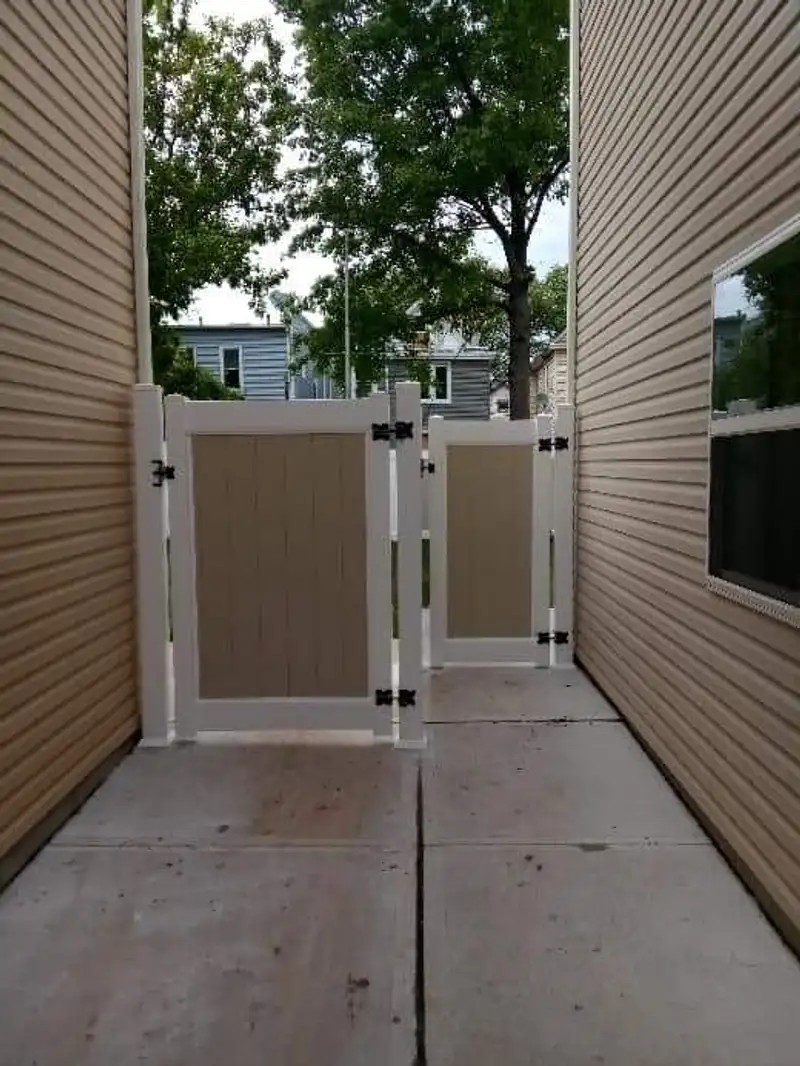 White vinyl privacy fence with gate by Fencing By Excellence near Atlantic Highlands, Monmouth County NJ
