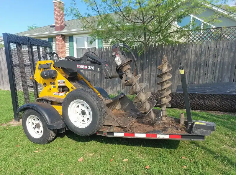 Cedar board-on-board wood fence installation in a Monmouth County NJ backyard